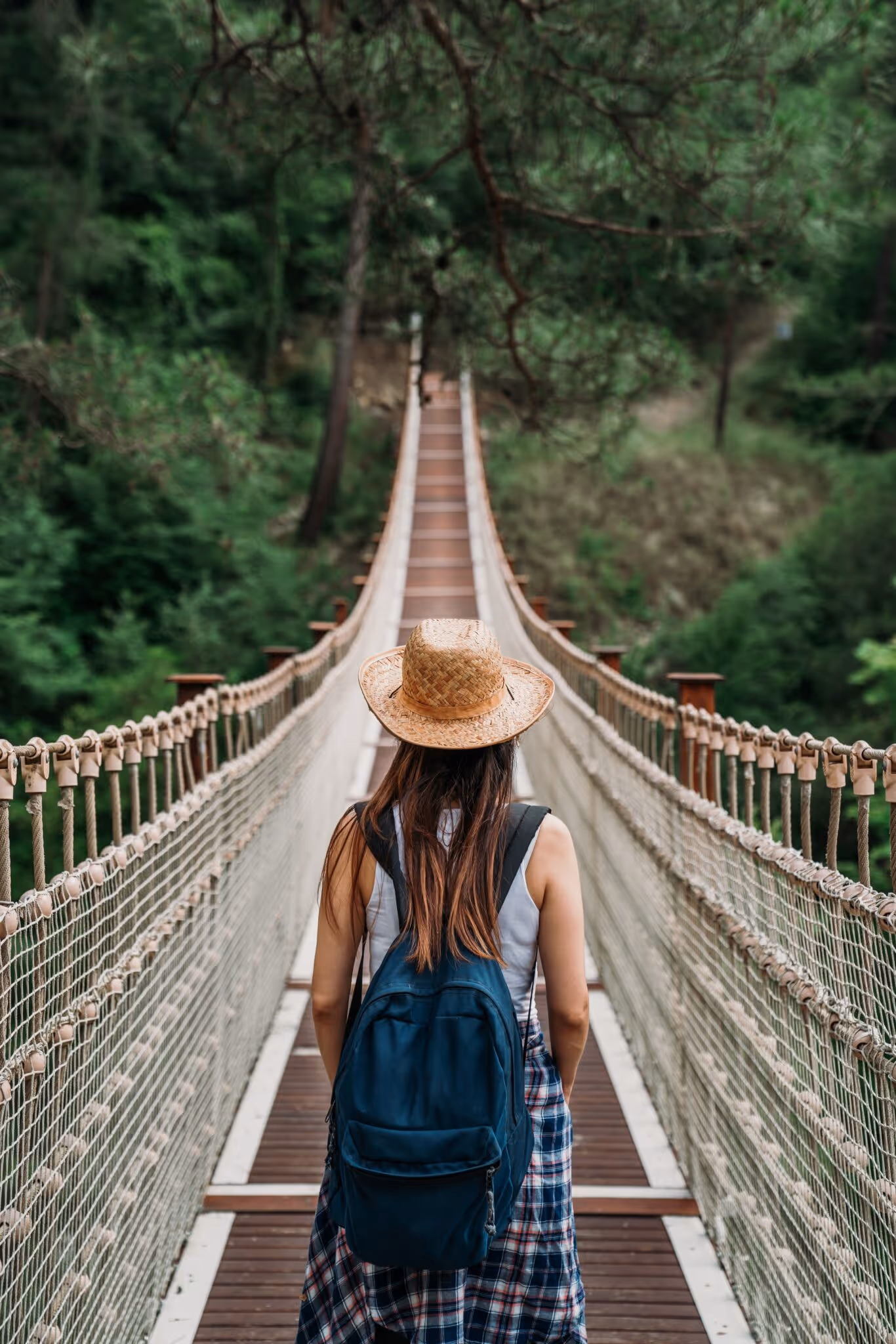 Solo female traveller walking on a bridge in Phitsanulok