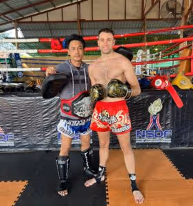 Kru Jay training with local Thai fighter in the ring