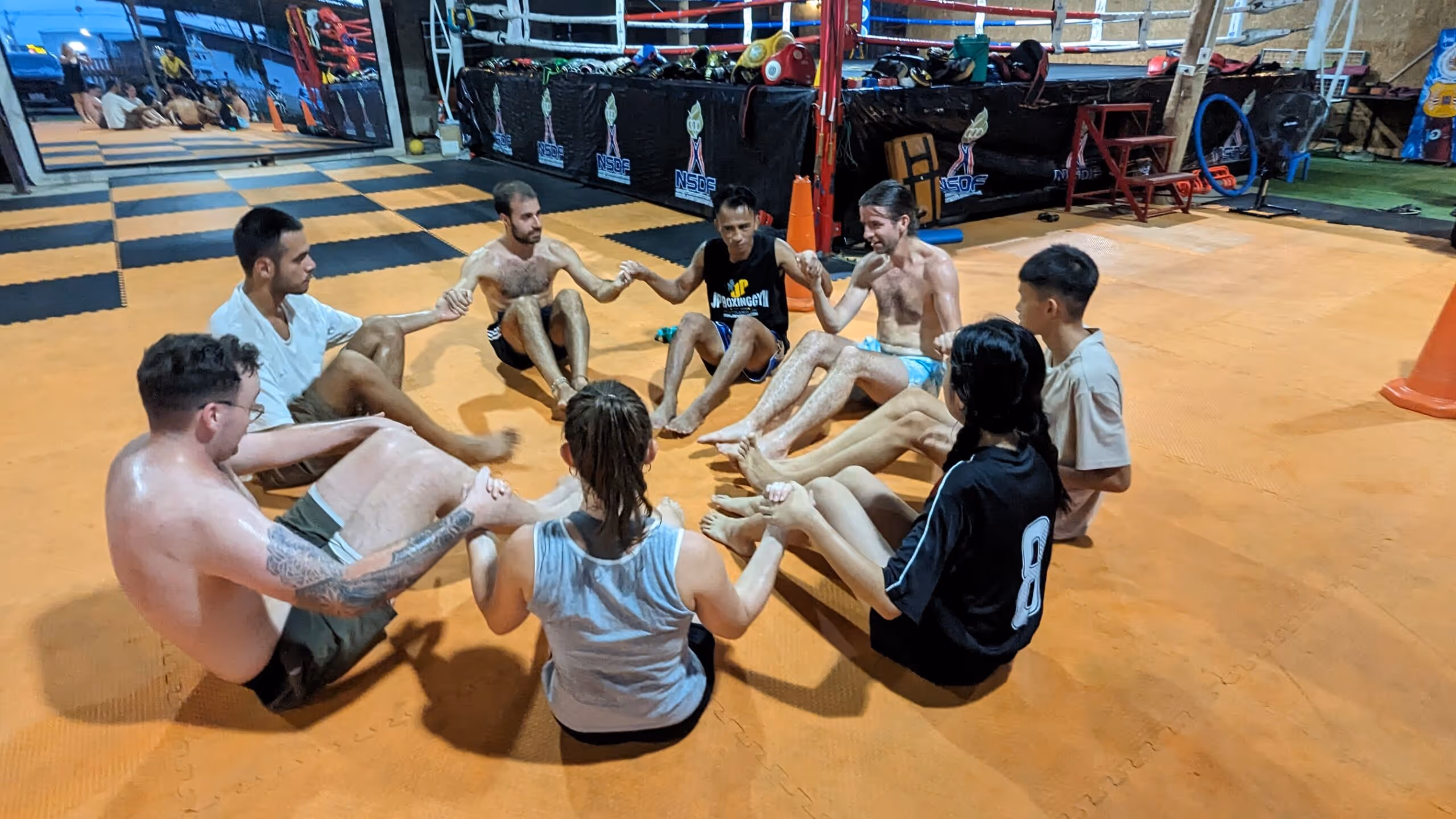 Group photo of Muay Thai fighters and students