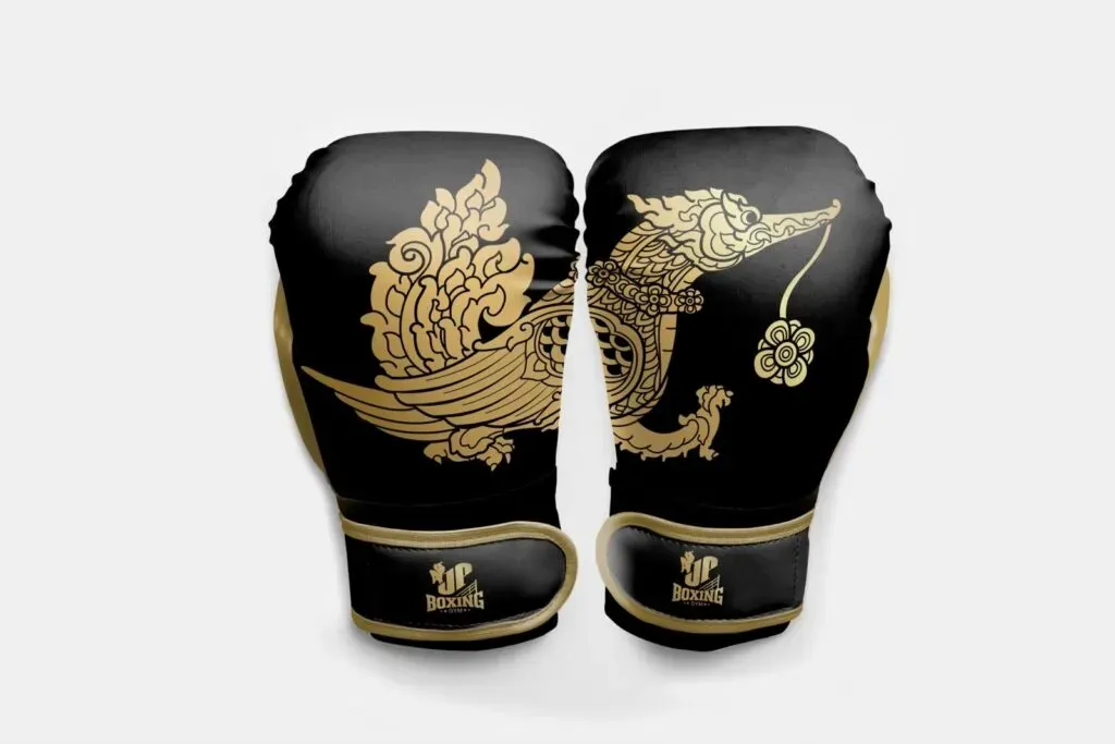 Muay Thai gloves resting on wooden stool